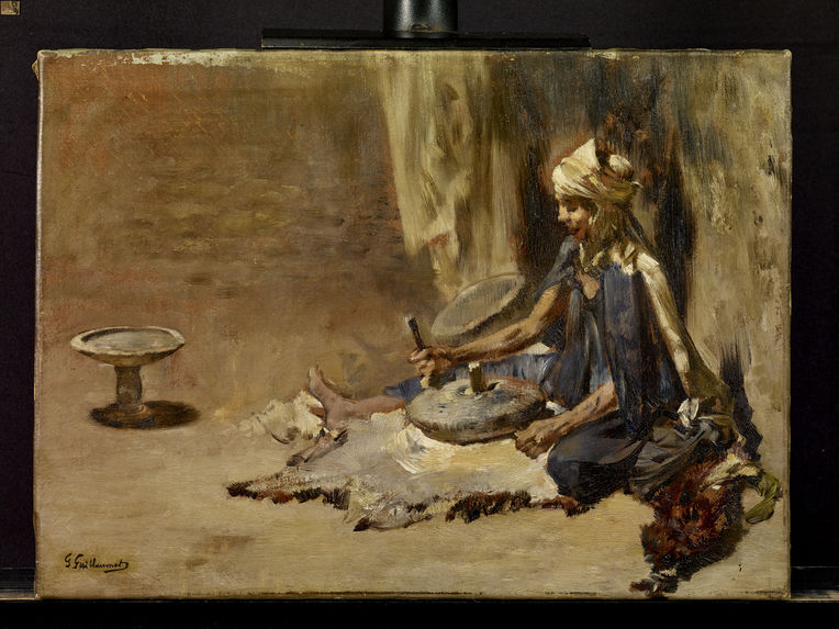 Femme arabe préparant le couscous