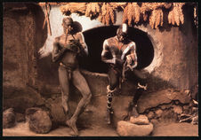 Two young Nuba men playing the lyre