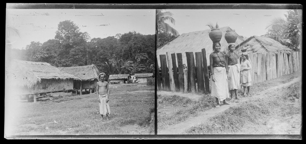 Village, homme. Porteurs d'eau Cham devant une palissade